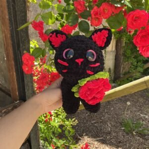 Chaton romantique avec rose